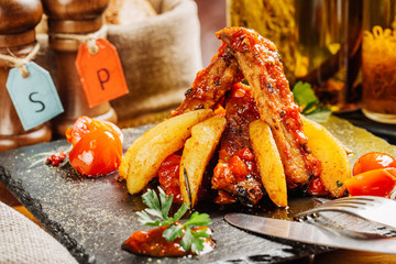 barbecue pork spareribs with tomato and potato