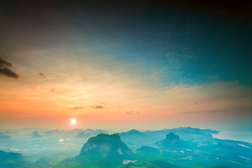 Obraz na płótnie Canvas mountains under colorful sky in sunset