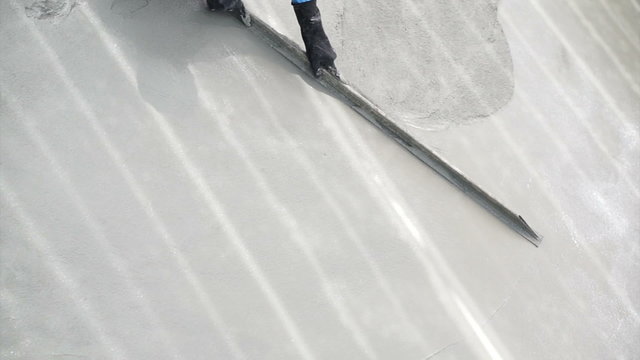 Video of Special plastering equipment for troweling cement floor surface smoothening adjustment. Construction technique and skill