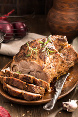 Sliced roasted pork and knife