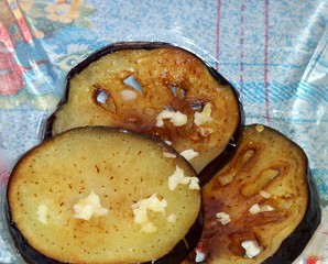 Eggplant fried in olive oil with garlic and parsley