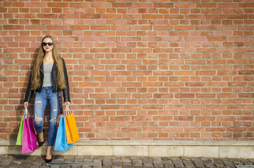 Young attractive woman with colorful shopping bags