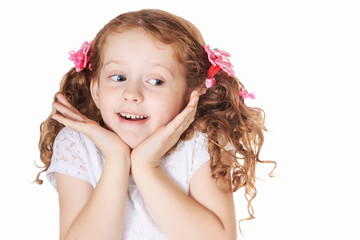 Surprised little girl in light background