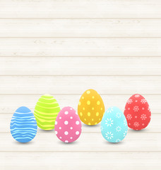 wooden background with colorful traditional eggs for Easter