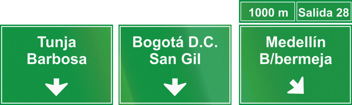 A Directional Road Sign In Colombia, Located Above Highway Lanes