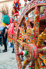Close up view of a colorful wheel of a typical sicilian cart