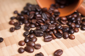 Cup and Coffee beans on wooden background