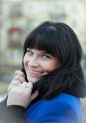 Fototapeta premium Portrait of girl in blue coat