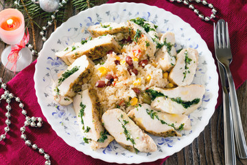 Fillet baked with herbs and rice on the festive table