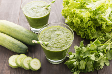 Healthy green vegetables smoothie on rustic wood table