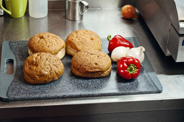 Hamburger buns on a cutting board