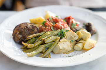 Vegetable plate of marinated green beans and bell peppers, fried