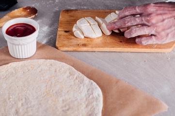 Chopping mozzarella for pizza