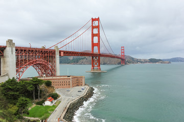 Golden Gate bridge view from the hill in the cloudy day.
