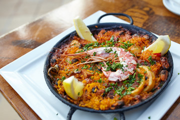 Seafood paella in the fry pan with copy space