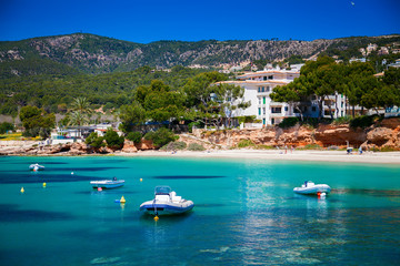 boats in front of the beach in Portals Nous