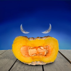 Halloween devil pumpkin face put on terrace wood