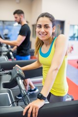 Couple using treadmills together