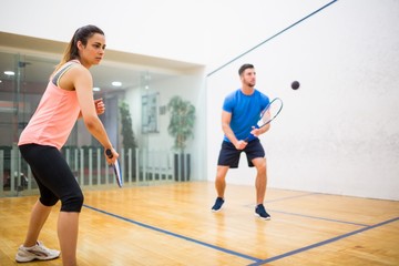 Couple play some squash together