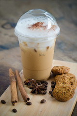 ice coffee in cup on wooden table