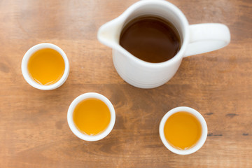 Fototapeta na wymiar Cup of tea with teapot