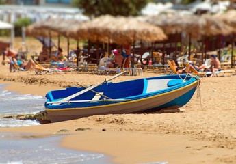 Fototapeta premium Wooden boat on the beach. Space for your text.