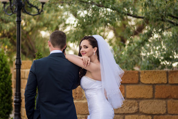 Man stands back. Bride is smiling