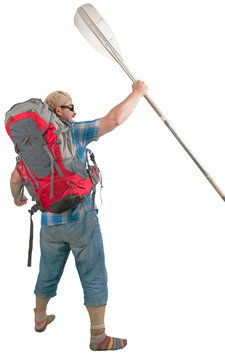 Tourist man with backpack and paddle