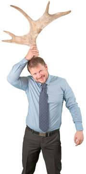 Middle-aged Businessman With Elk Horns On White Background