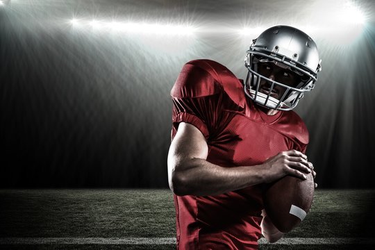 Composite image of american football player in red jersey 