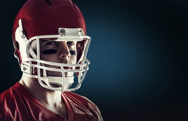 Composite image of american football player looking at camera