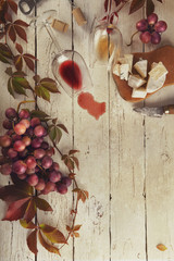 Food frame with wine, grapes and cheese