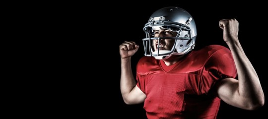 Composite image of happy sportsman cheering with clenched fist