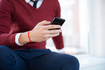Male hand with smartphone