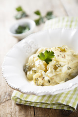 Potato salad with eggs and gherkins