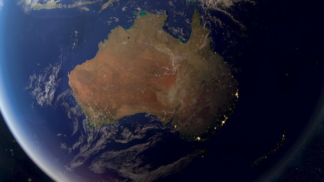 Orbiting over Australia from space. Photorealistic 3d animation, created using extremely high resolution (50k+) textures. As the sun sets you see the cities light up.