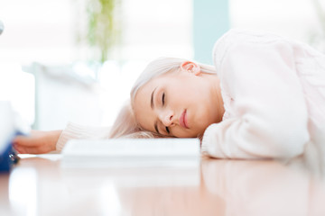 Female student sleeping on the table