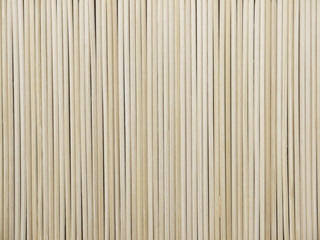 Fototapeta premium pile of wooden bamboo skewers background