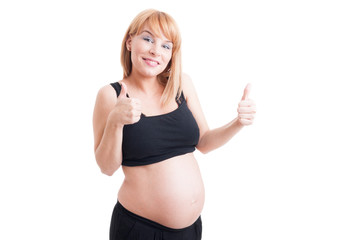 cute young pregnant girl pointing finger to the camera