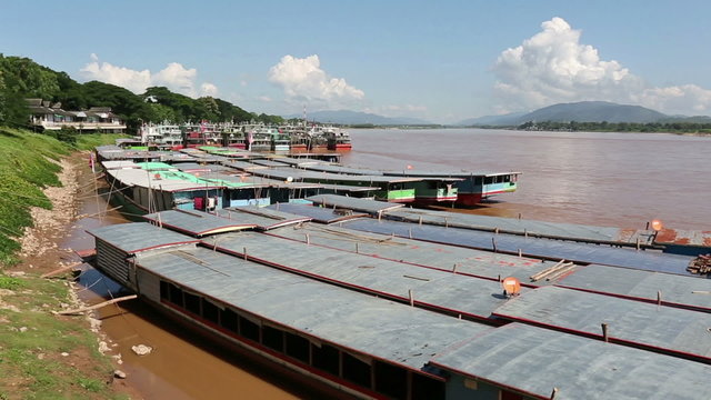 Laos and Chinese cargo boats in Mekong river at Chiang saen dock ,Thailand.