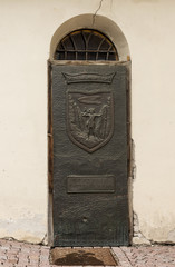 Ancient iron door handle on iron medieval door in Canazei, italy.