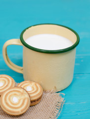 cookies and milk on blue wooden background