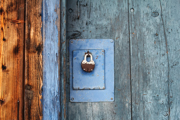 vintage wooden door and padlock