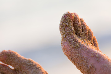 Sand on feet