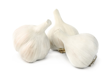 Garlic. Three cloves of garlic arranged on a white background close-up