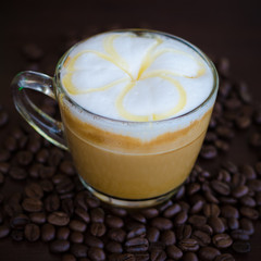 a glass of hot latte art coffee
