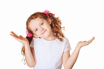 Surprised girl spreading hands over white background.