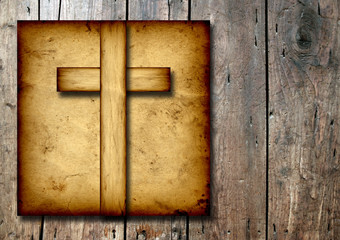 Old vintage Christian paper cross on wood