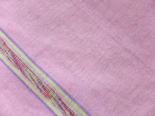 Striped bright pink cotton handkerchief texture background