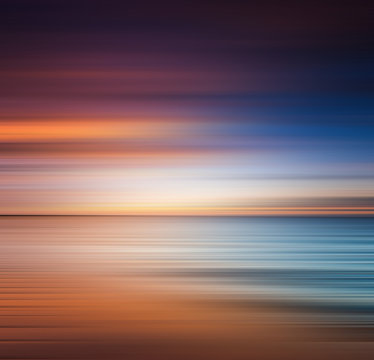 Sunset at the beach. Blurred panning motion. Abstract